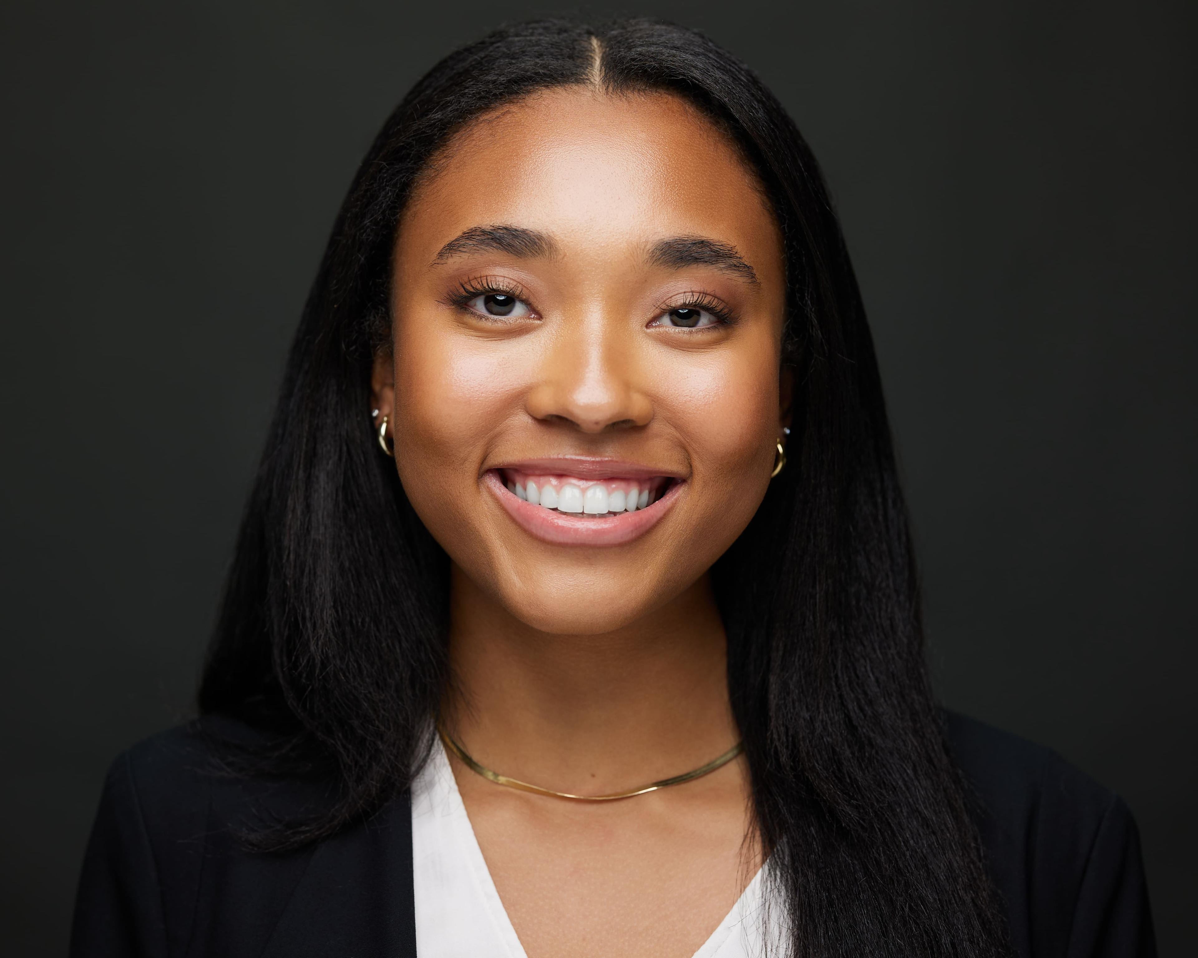 Portrait of Sanaa Sloan, Co-Founder & Chief Social Impact Officer at Navigating Grey